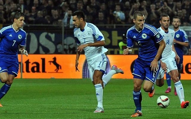 Bosnia and Herzegovina's Ognjen Vranjes (C) runs in front of Israel's Ben Sahar (2nd R) and Eran Zahavi (2nd L) during the Euro 2016 qualifier match between Bosnia and Herzegovina and Israel on June 12, 2015 in Zenica. (AFP/ ELVIS BARUKCIC) Bosnia and Herzegovina's Ognjen Vranjes (C) runs in front of Israel's Ben Sahar (2nd R) and Eran Zahavi (2nd L) during the Euro 2016 qualifier match between Bosnia and Herzegovina and Israel on June 12, 2015 in Zenica. (AFP/ ELVIS BARUKCIC)