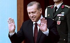 Turkey's President Recep Tayyip Erdogan greets members of parliament as he arrives for a swearing-in ceremony at the Turkish parliament in Ankara, Turkey, June 23, 2015. (AFP/ADEM ALTAN)