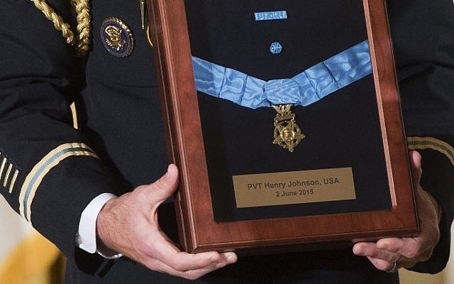 A military aide holds the Medal of Honor for the late Army Private Henry Johnson, for actions while serving in France during World War I, during a ceremony in the East Room of the White House in Washington, DC, June 2, 2015. (AFP/SAUL LOEB) A military aide holds the Medal of Honor for the late Army Private Henry Johnson, for actions while serving in France during World War I, during a ceremony in the East Room of the White House in Washington, DC, June 2, 2015. (AFP/SAUL LOEB)