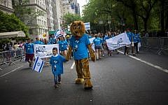 People take part in the Celebrate Israel Parade along Fifth Avenue May 31, 2015 in New York City.  (Eric Thayer/Getty Images/AFP)