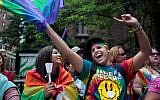 People watch the Gay Pride Parade in New York City on June 28, 2015 (Yana Paskova/Getty Images/AFP)
