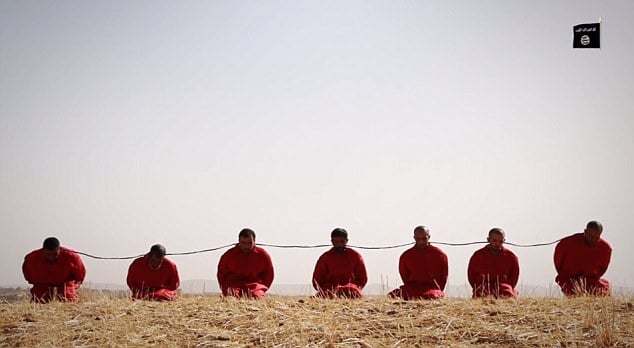 Islamic State jihadists kill seven men by blowing up detonator cord tied around their necks, in a video released June 23, 2015. (Screen capture) Islamic State jihadists kill seven men by blowing up detonator cord tied around their necks, in a video released June 23, 2015. (Screen capture)