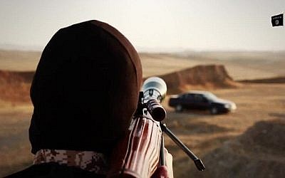 Islamic State jihadists kill four men by firing a rocket-propelled grenade at the car they are riding in, as seen in a video released June 23, 2015. (Screen capture) Islamic State jihadists kill four men by firing a rocket-propelled grenade at the car they are riding in, as seen in a video released June 23, 2015. (Screen capture)