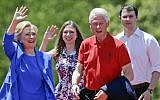File: Democratic presidential candidate Hillary Clinton waves to supporters as her husband former president Bill Clinton, second from right, Chelsea Clinton, second from left, and her husband Marc Mezvinsky, join on stage Saturday, June 13, 2015, on Roosevelt Island in New York. (AP Photo/Frank Franklin II)