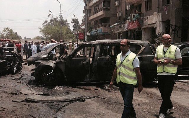 Emergency personnel inspect damage after a bomb attack targeted Egypt's state prosecutor in the Heliopolis district of Cairo, Egypt, June 29, 2015. (AP Photo/Ahmed Hatem) Emergency personnel inspect damage after a bomb attack targeted Egypt's state prosecutor in the Heliopolis district of Cairo, Egypt, June 29, 2015. (AP Photo/Ahmed Hatem)