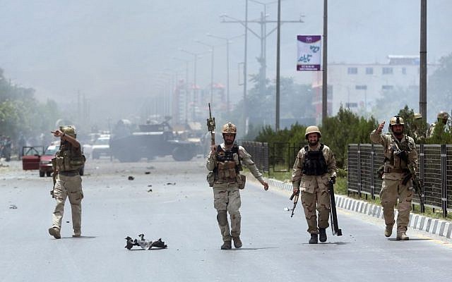 Afghan security forces inspect the site of a suicide attack during clashes with Taliban fighters in front of the Parliament, in Kabul, Afghanistan, June 22, 2015. (AP/ Massoud Hossaini) Afghan security forces inspect the site of a suicide attack during clashes with Taliban fighters in front of the Parliament, in Kabul, Afghanistan, June 22, 2015. (AP/ Massoud Hossaini)