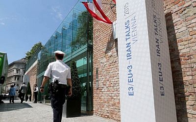 A Police guard walks past Palais Coburg where closed-door nuclear talks with Iran take place in Vienna, Austria, Friday June 26, 2015. (AP/Ronald Zak)