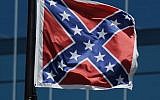 The Confederate flag flies near the South Carolina Statehouse, Friday, June 19, 2015, in Columbia, South Carolina (AP Photo/Rainier Ehrhardt)
