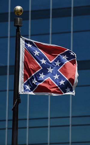 The Confederate flag flies near the South Carolina Statehouse, Friday, June 19, 2015, in Columbia, South Carolina (AP Photo/Rainier Ehrhardt)