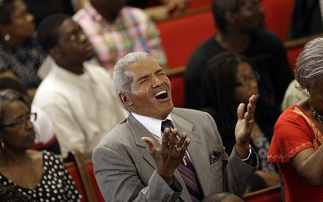 Parishioners sing at the Emanuel A.M.E. Church in Charleston, S.C. on Sunday, June 21, 2015, four days after a mass shooting that claimed the lives of it's pastor and eight others (AP Photo/David Goldman, Pool) Parishioners sing at the Emanuel A.M.E. Church in Charleston, S.C. on Sunday, June 21, 2015, four days after a mass shooting that claimed the lives of it's pastor and eight others (AP Photo/David Goldman, Pool)