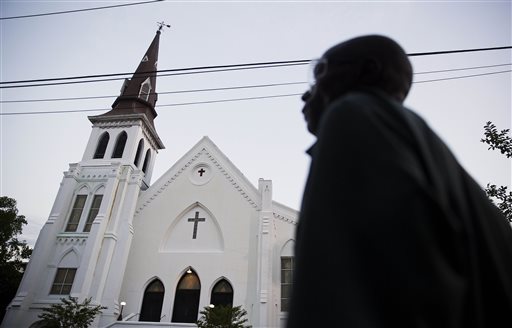 The steeple of Emanuel African Methodist Episcopal Church stands as a pedestrian passes early Sunday, June 21, 2015, in Charleston, S.C. (AP Photo/David Goldman) The steeple of Emanuel African Methodist Episcopal Church stands as a pedestrian passes early Sunday, June 21, 2015, in Charleston, S.C. (AP Photo/David Goldman)