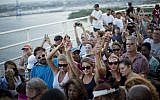 People join hands in a moment of silence as thousands of marchers meet on Charleston's main bridge in a show of unity after nine black church parishioners were gunned down during a Bible study, Sunday, June 21, 2015, in Charleston, S.C. (AP Photo/David Goldman)
