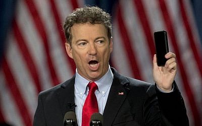 In this April 7, 2015 file photo, Sen. Rand Paul, R-Ky. holds up his cell phone as he speaks before announcing the start of his presidential campaign, in Louisville, Ky. (AP/Carolyn Kaster, File)