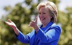 Democratic presidential candidate, former Secretary of State Hillary Rodham Clinton, gestures to supporters as she arrives to speak Saturday, June 13, 2015, on Roosevelt Island in New York. (AP Photo/Julio Cortez)