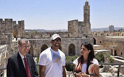 Professional baseball player Mariano Rivera (center) and Eilat Lieber, director of the Tower of David Museum (right), meet Minister of Tourism Yariv Levin at the Tower of David in the Old City of Jerusalem, June 18, 2015. (Hamutal Wachtel)