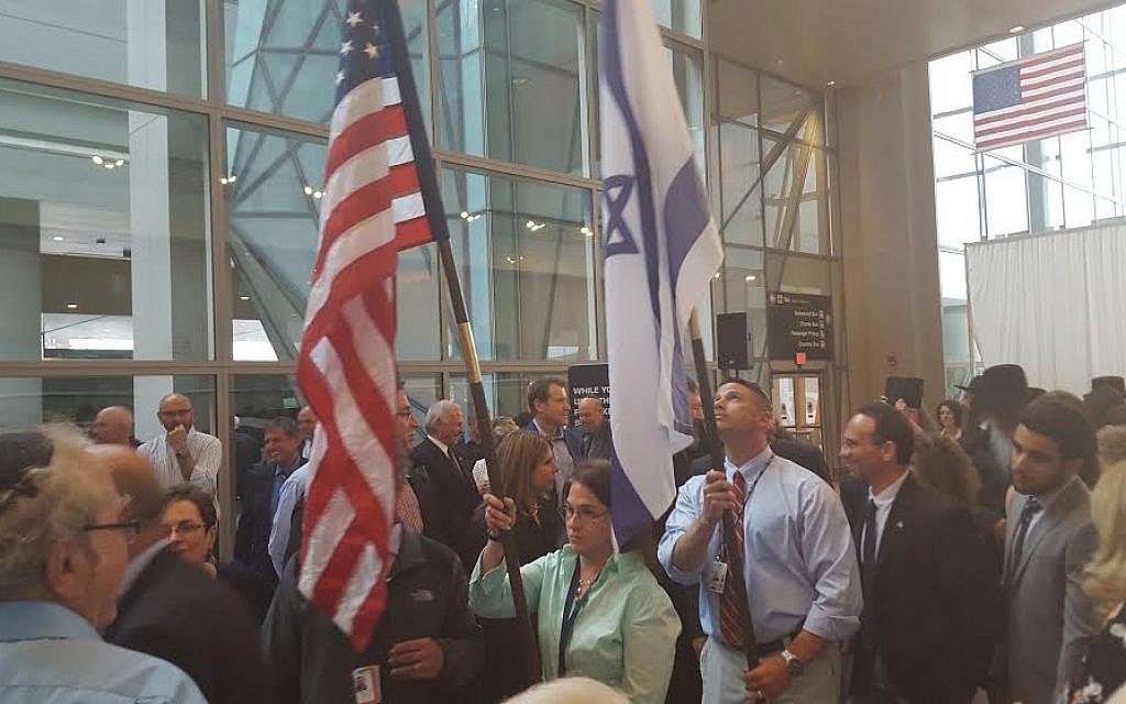 Officials from El Al Israel Airlines and Boston's Massachusetts Port Authority carry the US and Israeli flags during a launch ceremony for El Al's new Boston-TLV nonstop flights, held on June 28, 2015 at Logan International Airport. (Matt Lebovic) Officials from El Al Israel Airlines and Boston's Massachusetts Port Authority carry the US and Israeli flags during a launch ceremony for El Al's new Boston-TLV nonstop flights, held on June 28, 2015 at Logan International Airport. (Matt Lebovic)