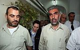 Sheikh Kamal Khatib of the Islamic movement, right, is brought to arraignment in a Jerusalem court after being arrested for provoking riots on the Temple Mount and East Jerusalem, October 4, 2009. (Matanya Tausig/Flash90)