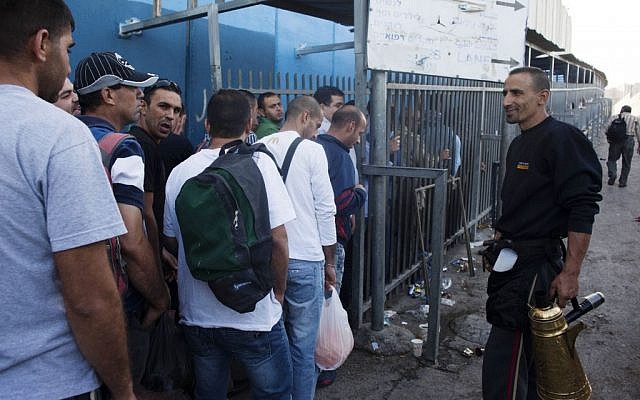 Palestinian workers wait to cross through a checkpoint in Bethlehem, June 2, 2013 (Neal Badache/FLASH90) Palestinian workers wait to cross through a checkpoint in Bethlehem, June 2, 2013 (Neal Badache/FLASH90)