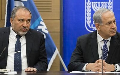 Prime Minister Benjamin Netanyahu and then-foreign minister Avigdor Liberman in the Knesset, February 3, 2014. (FLASH90)