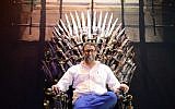 Knesset member Oren Hazan sits in a model of the Iron Throne from TV's 'Game of Thrones' during an exhibition in Tel Aviv on Sunday April 5, 2015 (Tomer Neuberg/Flash90)