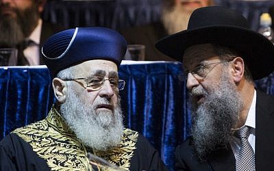 Sephardic Chief Rabbi Yitzhak Yosef, left, speaks with his brother David Yosef, April 5, 2015. (photo credit: Yonatan Sindel/Flash90)