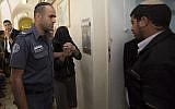 A suspect in the murder of Tazera Takao is led into Jerusalem's Magistrates' Court on June 1, 2015. (Photo by Yonatan Sindel/Flash90)