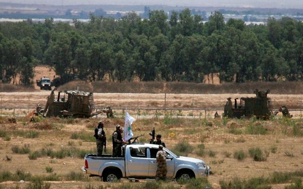 Gunmen from the Izz ad-Din al-Qassam Brigades, Hamas' armed wing, patrol an area near the Israeli border with Rafah in the southern Gaza Strip on June 3, 2015 (Abed Rahim Khatib/Flash90) Gunmen from the Izz ad-Din al-Qassam Brigades, Hamas' armed wing, patrol an area near the Israeli border with Rafah in the southern Gaza Strip on June 3, 2015 (Abed Rahim Khatib/Flash90)
