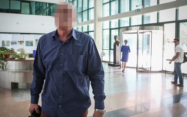 A retired senior police officer enters Police Investigation Unit in Jerusalem for questioning on June 8, 2015. The identity of the former major general in the Israel Police has not been cleared for publication. (Hadas Parush/Flash90) A retired senior police officer enters Police Investigation Unit in Jerusalem for questioning on June 8, 2015. The identity of the former major general in the Israel Police has not been cleared for publication. (Hadas Parush/Flash90)