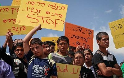 Arab Israelis and Bedouins protest at Beersheba city hall against the Israeli court's recent decision to evacuate the Bedouin village of Umm al-Hiran on June 11, 2015. (Talucho/Flash90)