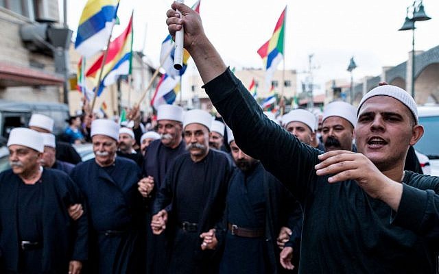 Israeli Druze in the village of Yarka attend a demonstration in support of Syrian Druze communities threatened by that country's civil war, June 14, 2015. (Basel Awidat/Flash90) Israeli Druze in the village of Yarka attend a demonstration in support of Syrian Druze communities threatened by that country's civil war, June 14, 2015. (Basel Awidat/Flash90)