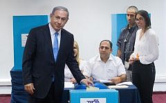 Prime Minister Benjamin Netanyahu votes at a polling station in Jerusalem on the method of elections within the Likud party, June 14, 2015. (Miriam Alster/FLASH90)