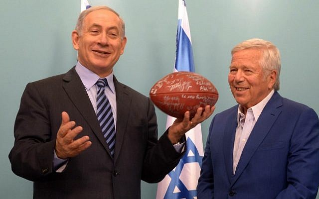 New England Patriots owner Robert Kraft gives Prime Minister Benjamin Netanyahu a signed football during a meeting with former players at the Prime Minister's Office in Jerusalem on June 22, 2015. (Amos Ben Gershom/GPO) New England Patriots owner Robert Kraft gives Prime Minister Benjamin Netanyahu a signed football during a meeting with former players at the Prime Minister's Office in Jerusalem on June 22, 2015. (Amos Ben Gershom/GPO)