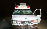 The IDF ambulance attacked by Druze Israeli residents in the Golan Heights as it ferried Syrian war casualties for medical treatment in Israel, June 22, 2015. (Basel Awidat/Flash90)