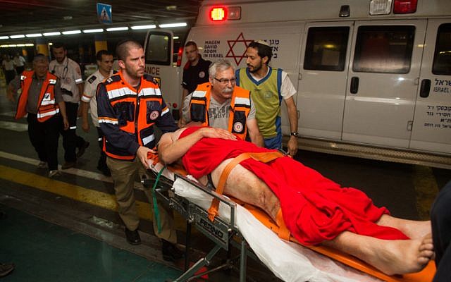 An Israeli wounded in a drive-by shooting attack is brought to Shaare Zedek hospital in Jerusalem, June 29, 2015. (Yonatan Sindel/Flash90) An Israeli wounded in a drive-by shooting attack is brought to Shaare Zedek hospital in Jerusalem, June 29, 2015. (Yonatan Sindel/Flash90)
