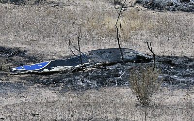 Scattered debris remains on the ground following a plane crash near the town of Ventucopa, Calif., Monday, June 22, 2015. (Mike Eliason/Santa Barbara County Fire Department via AP)