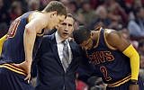 In this May 14, 2015, file photo, Cleveland Cavaliers head coach David Blatt, center, talks with Timofey Mozgov (20) and Kyrie Irving (2) during the first half of Game 6 in a second-round NBA basketball playoff series against the Chicago Bulls in Chicago. (AP/Nam Y. Huh, File)