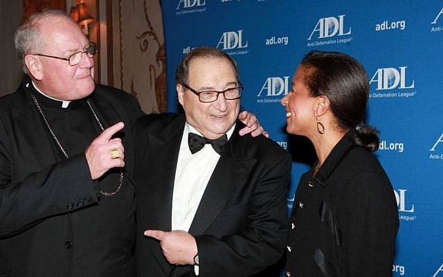 Abe Foxman, center, speaks with Cardinal Timothy Dolan and Susan Rice, the US national security adviser, at an event in New York honoring the outgoing national director of the Anti-Defamation League, June 17, 2015. (JTA/ David Karp)