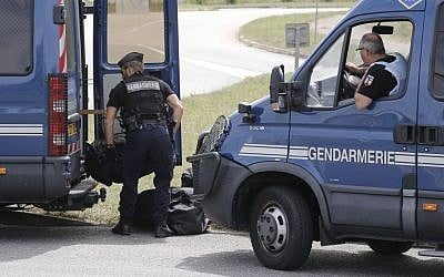 Riot police officers block the area where an attack took place, Friday, June 26, 2015 in Saint-Quentin-Fallavier, southeast of Lyon, France.  (AP/Laurent Cipriani)