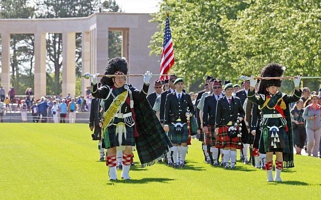 A bagpipe band perform duties at the Colleville American military cemetery, in Colleville sur Mer, western France, Saturday June 6, 2015, as part of the commemoration of the 71st anniversary of the D-Day landing. (AP/Remy de la Mauviniere)