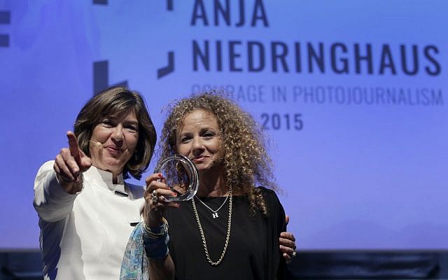 CNN journalist Christiane Amanpour, left, hands the 2015 Anja Niedringhaus Award to photographer Heidi Levine, in Berlin, Thursday, June 25, 2015. (AP Photo/Michael Sohn) CNN journalist Christiane Amanpour, left, hands the 2015 Anja Niedringhaus Award to photographer Heidi Levine, in Berlin, Thursday, June 25, 2015. (AP Photo/Michael Sohn)