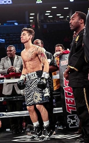 Jewish boxer Dustin Fleischer sports striped trunks embellished with a Star of David in the ring. (Edwin Nadera) Jewish boxer Dustin Fleischer sports striped trunks embellished with a Star of David in the ring. (Edwin Nadera)