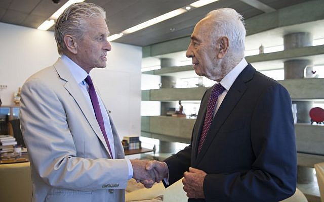 Actor Michael Douglas (L) and former president Shimon Peres on June 17, 2015 (Courtesy)