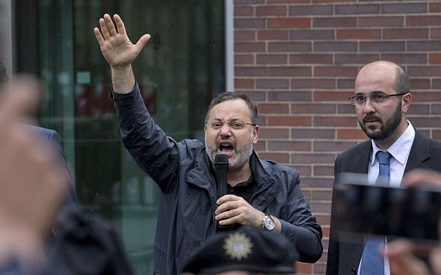 Ahmed Mansour, 52, a senior journalist with the Qatar-based broadcaster Al-Jazeera, delivers a statement after he left the security checkpoint of the Moabit jail in Berlin, Germany, June 22, 2015. (AP/Michael Sohn, File) 