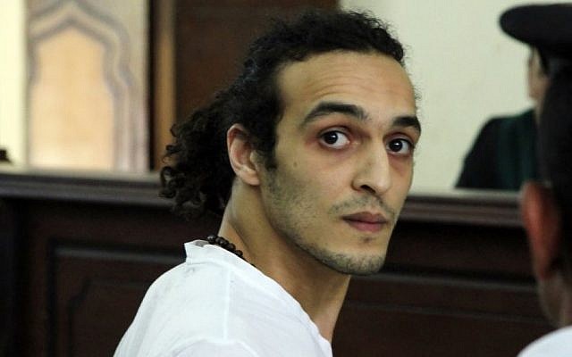 Egyptian photojournalist Mahmoud Abou Zeid, known by his nickname Shawkan, appears before a judge for the first time after spending more than 600 days in prison, May 14, 2015, Cairo, Egypt. (Lobna Tarek, El Shorouk Newspaper via AP, File ) 