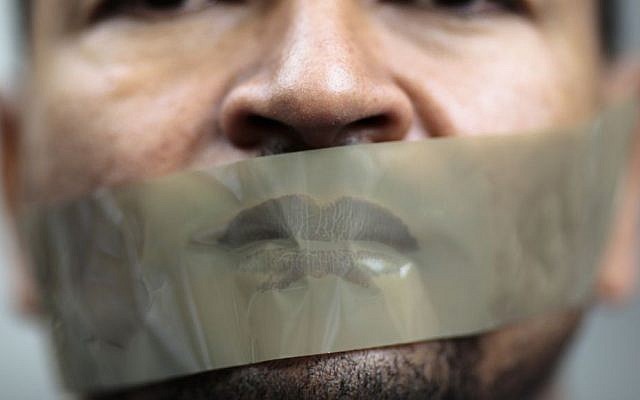 A man with tape on his mouth attends a demonstration in front of a court to support Ahmed Mansour, a senior journalist with the Qatar-based broadcaster Al-Jazeera, June 22, 2015. (AP/Markus Schreiber, File) A man with tape on his mouth attends a demonstration in front of a court to support Ahmed Mansour, a senior journalist with the Qatar-based broadcaster Al-Jazeera, June 22, 2015. (AP/Markus Schreiber, File)