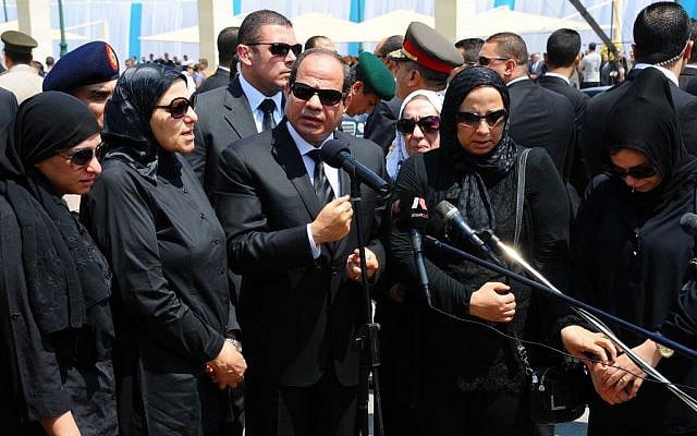 In this picture taken Tuesday, June 30, 2015, provided by the office of the Egyptian Presidency, Egyptian president Abdel-Fattah el-Sissi, center, speaks at the funeral for Hisham Barakat in Cairo. (Egyptian Presidency via AP) In this picture taken Tuesday, June 30, 2015, provided by the office of the Egyptian Presidency, Egyptian president Abdel-Fattah el-Sissi, center, speaks at the funeral for Hisham Barakat in Cairo. (Egyptian Presidency via AP)