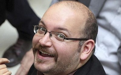 Jason Rezaian, an Iranian-American correspondent for The Washington Post, smiles as he attends a presidential campaign of President Hassan Rouhani in Tehran, Iran, April 11, 2013. (AP/Vahid Salemi, File) 