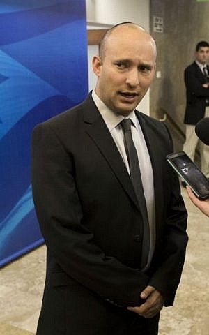 In this Jan. 18, 2015, file photo, Naftali Bennett speaks with the media ahead of a weekly cabinet meeting in Jerusalem. (Abir Sultan, Pool Photo via AP, File)