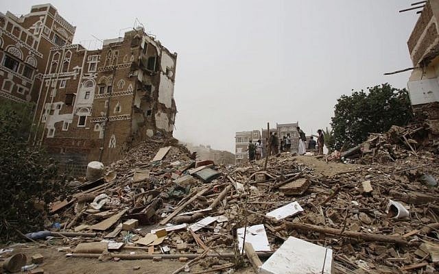 People search for survivors under the rubble of houses destroyed by Saudi airstrikes in the old city of Sana'a, Yemen, June 12, 2015. (AP/Hani Mohammed, File)
