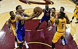 Golden State Warriors guard Stephen Curry (30) shoots in front of Cleveland Cavaliers center Tristan Thompson (13) during the second half of Game 3 of basketball's NBA Finals in Cleveland, Tuesday, June 9, 2015. The Cavaliers defeated the Warriors 96-91. (Larry W. Smith/Pool Photo via AP)